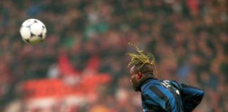 Taribo West of Inter Milan challenges George Weah of AC Milan. Milan Derby